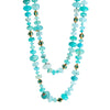 A long necklace of smithsonite, emerald-set-gold beads, with a leopard aquamarine and 18k yellow gold clasp.