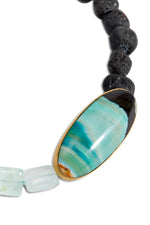 Aquamarine square beads, naturally tumbled black tourmaline round beads, fossilized opalized wood, 18k yellow gold.