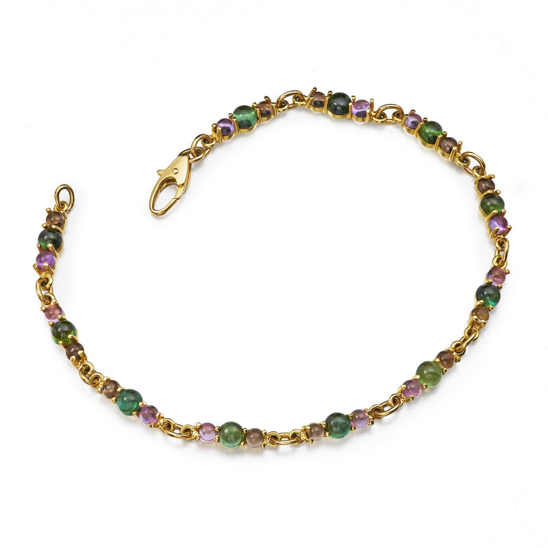modern tennis bracelet with cabochon cut tourmaline, amethyst and smokey citrine